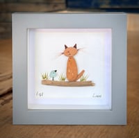 Sea-brick ginger cat with seaglass bird