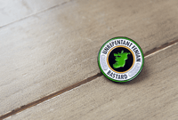 Image 1 of Unrepentant Fenian Bastard metal pin badge.