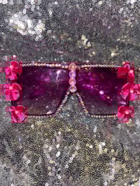 Image 1 of   Pink bowls, sunglasses  