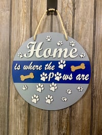 Image 1 of Home Is Where the Paws Are • 15” Painted Multi‑Layer Door Hanger
