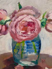 Image 3 of Pink roses in mustard jar on table