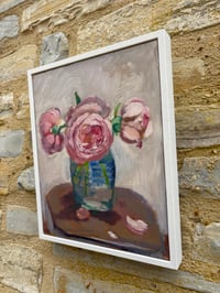 Image 4 of Pink roses in mustard jar on table