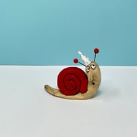 Image 1 of Red snail in party hat - Christmas Decor for the discriminating snail sculpture collector. 