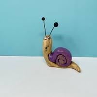 Image 5 of Snail in a shiny purple shell. 