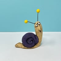 Image 1 of Snail with Yellow balls