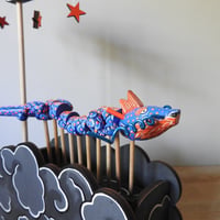 Image 5 of blue dragon in the nighttime
