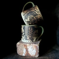 Image 1 of 5 faces sea mug<<<