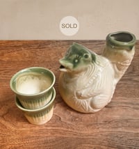 Image 1 of Tanuki carrying a fish on its back Sake Flask