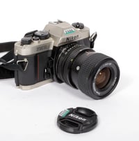 Image 1 of Nikon FM10 35mm SLR film camera with Zoom NIKKOR 35-70mm lens #2806 TESTED
