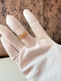 Image 1 of bow gold laminated ring 