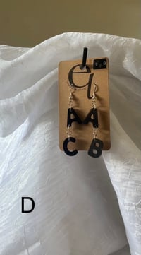 Image 5 of (glow in the dark) statement buchstabenohrringe