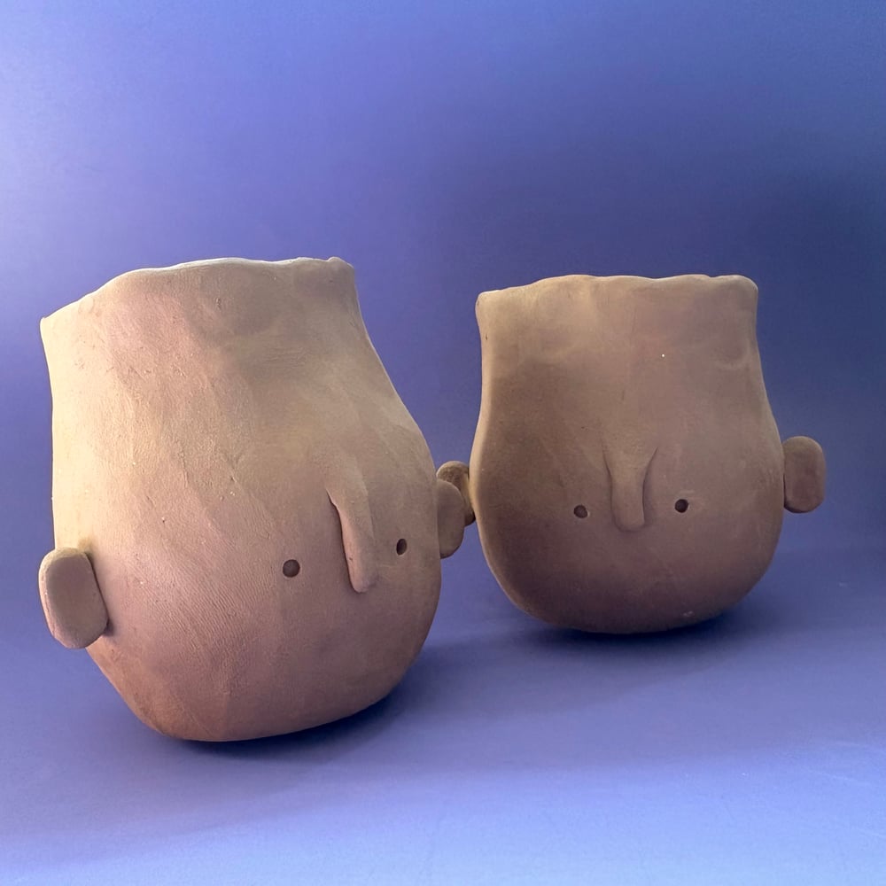 Image of Egg head face pot