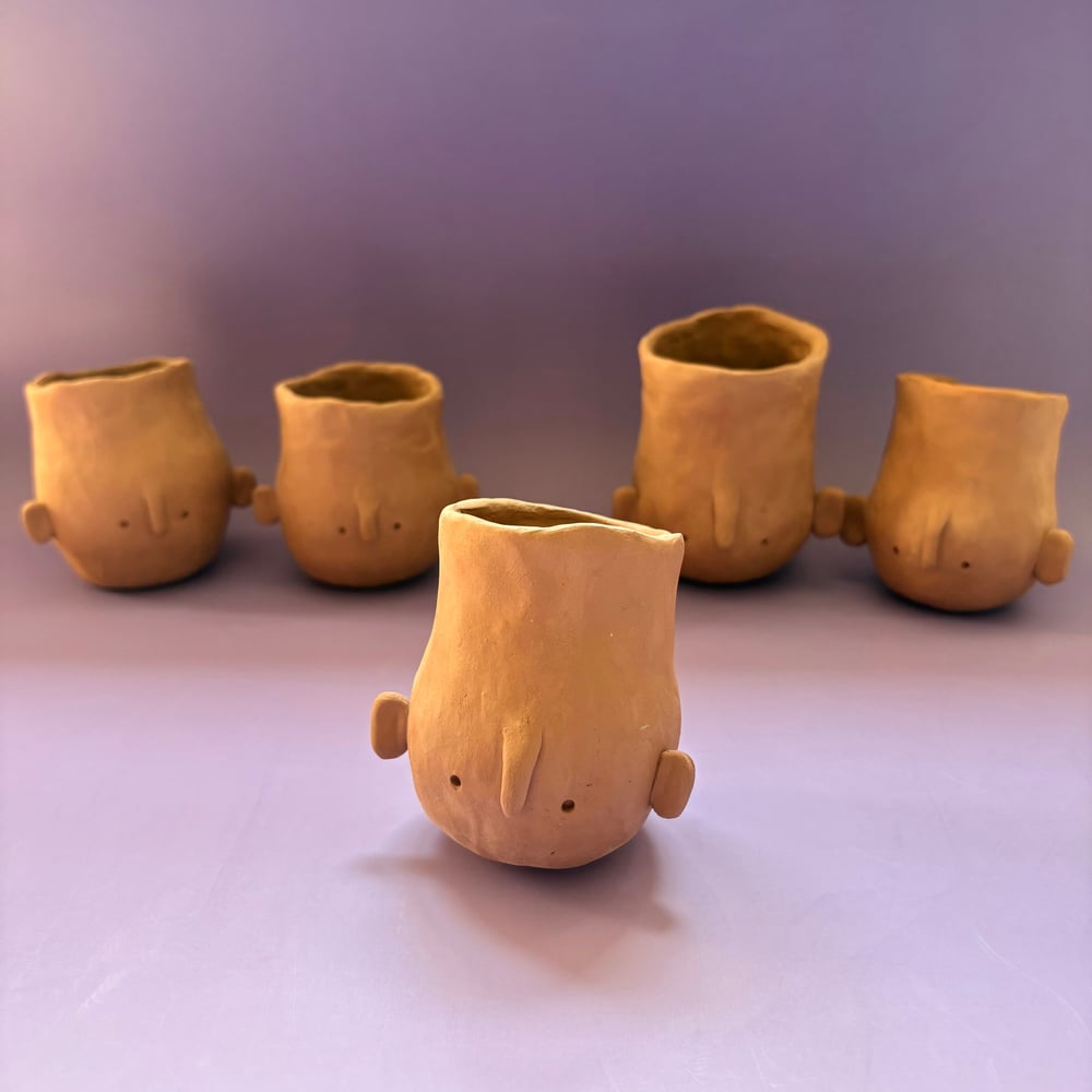 Image of Egg head face pot