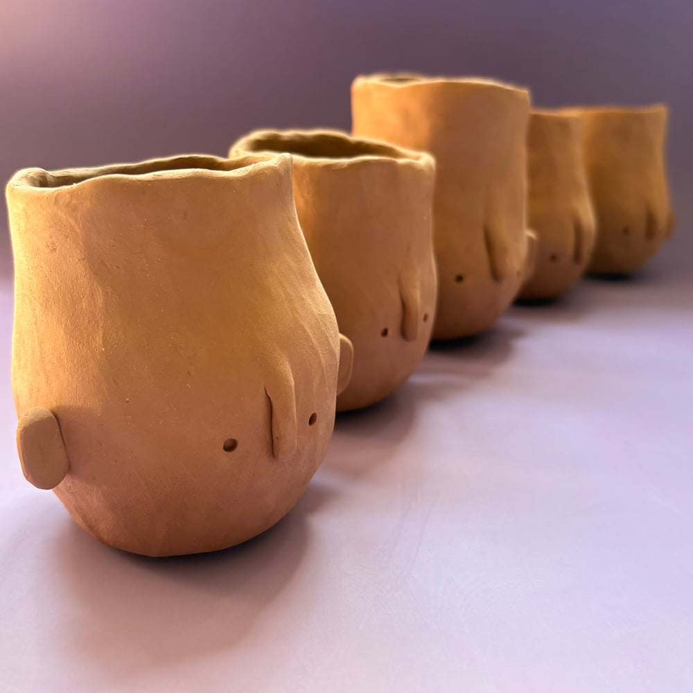 Image of Egg head face pot