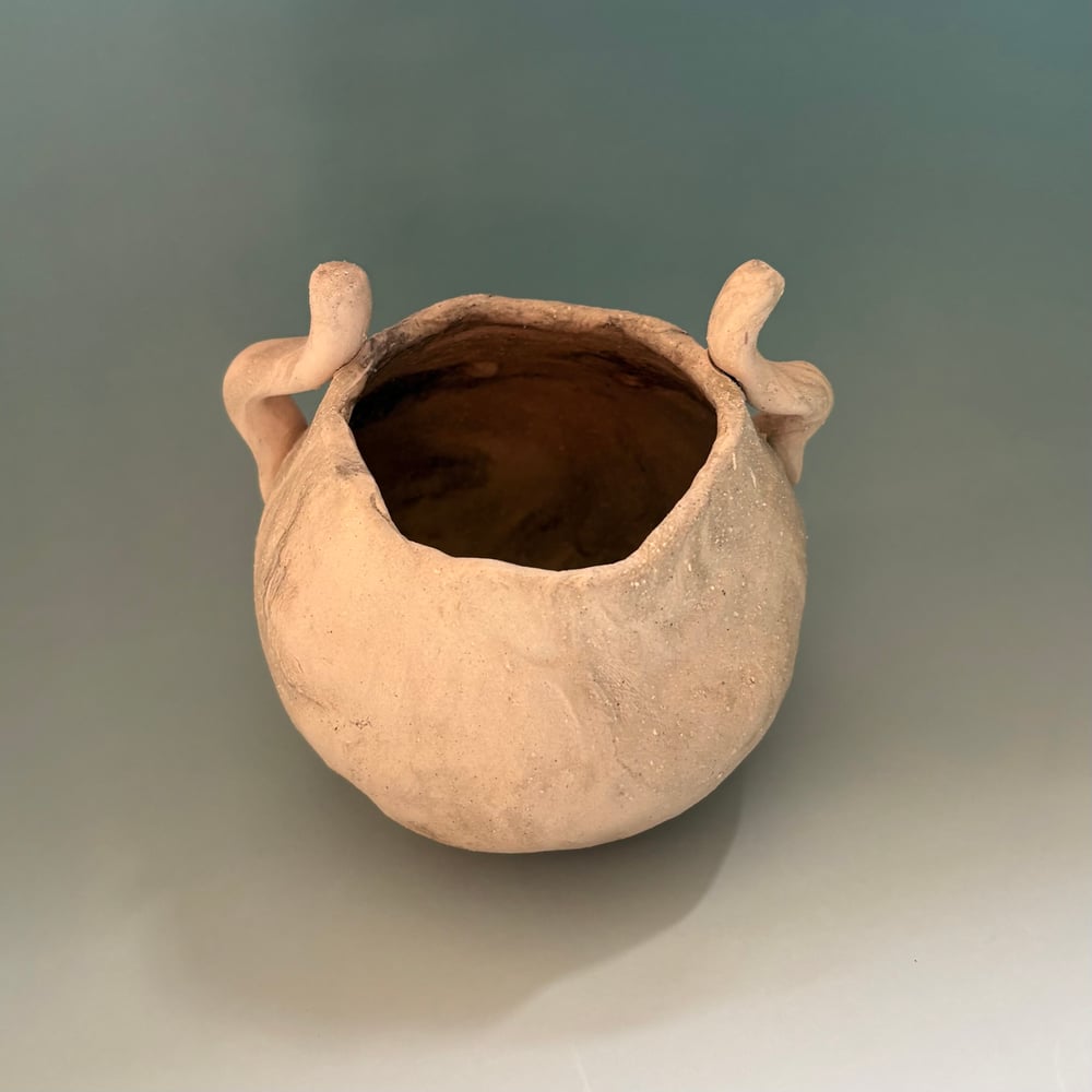 Image of Waving face pot