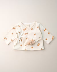 Image 1 of Cache-coeur Isadora · Petites oranges · Coton biologique