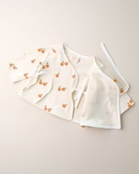 Image 2 of Cache-coeur Isadora · Petites oranges · Coton biologique