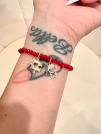 Image 2 of autism red stretchy bracelet with gold laminated charms 