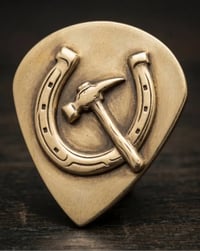 Image 1 of Solid Brass Plectrum - Embossed Hufschmid Edition