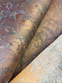 Image 1 of Copper combed hand marbled on brown paper // 5 sheets available 