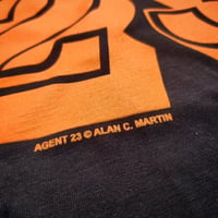 Image 8 of AGENT 23 - SYNCHRONICITY ENGINEER T-SHIRT with book, badge, and card