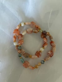 Pink and gold bracelets