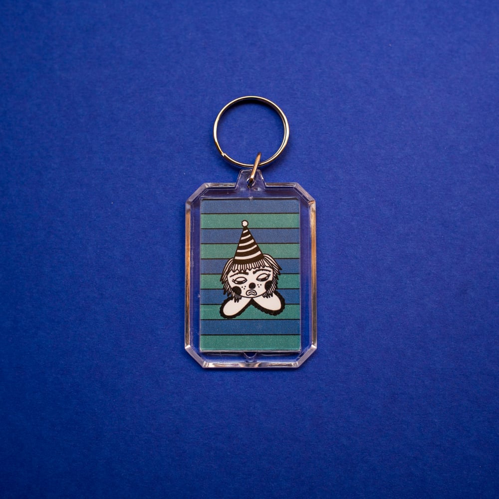 Image of simple sad clown key chain