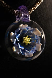Image 3 of blue daisy flower pendant made by Roe glass. 
