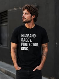 Image 1 of Husband Daddy Protector King Graphic Tee | Men's Motivational Slogan T-Shirt.