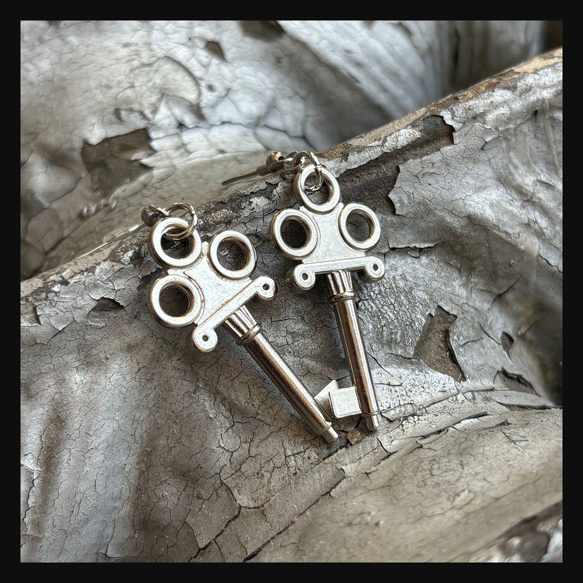 Ornate silver jewelry box key earrings