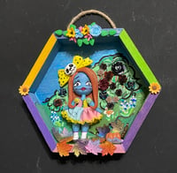 Image 1 of Halloween character in field of wild flowers & roses
