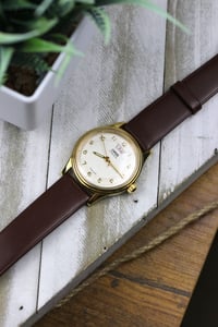 Image 2 of 1990s Oris Triple Date 7429 - Manual Winding Movement