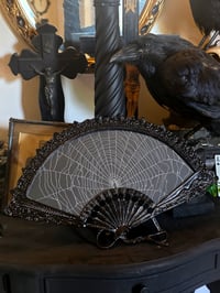 Image 1 of Vintage bkack ornate fan shaped frame with preserved web