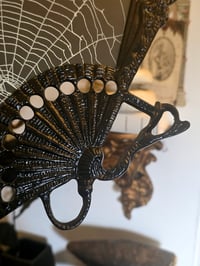 Image 4 of Vintage bkack ornate fan shaped frame with preserved web