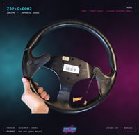 Image 2 of MOMO Three-Spoke Steering Wheel — Red Anodised / Black Leather