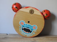 Image 4 of red ROAR bear wall hanging