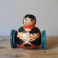 Image 1 of wheeled daruma girl
