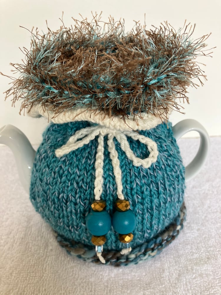 Image of small TURQUOISE n BROWN Go On! tea cosie