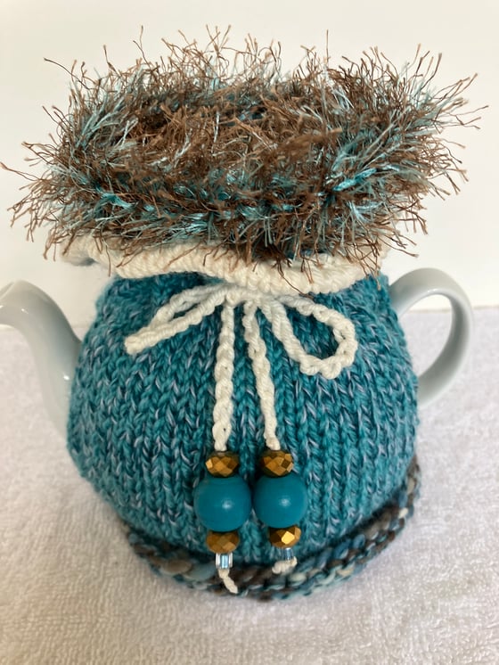 Image of small TURQUOISE n BROWN Go On! tea cosie