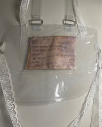 Image 1 of Never Become Discouraged Vinyl Bib