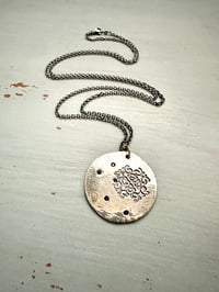 Image 3 of blue sapphire pendant with Fitzgerald quote