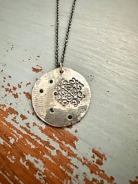 Image 1 of blue sapphire pendant with Fitzgerald quote