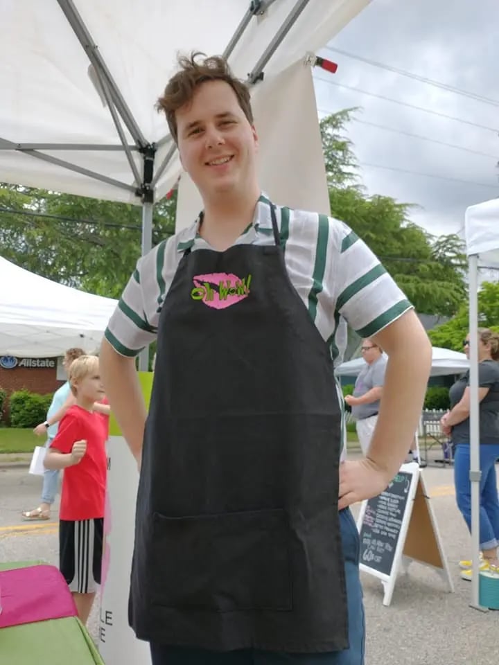 Oh WoW!&reg; employee with a branded apron