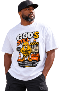Image 1 of God's Still Working on Me Drop Shoulder Graphic T-Shirt
