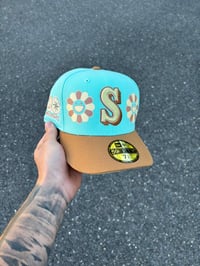 Image 1 of  CREAM BRIM TURQUOISE MULTI TONE SEATTLE MARINERS CUSTOM FITTED CAP