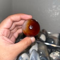 Image 4 of Carnelian x Orca Agate Sphere