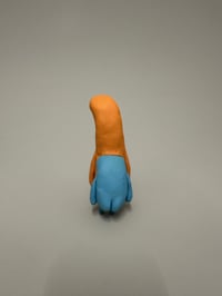 Image 5 of A blue thing peeking out of a brown thing 2