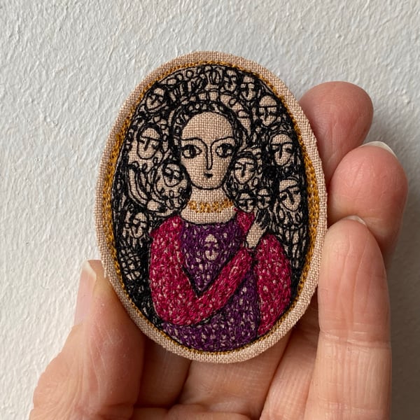 Image of portrait of a woman in purple and pink 
