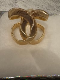 Image 1 of Twisted knot  will fit up to 91/2 wrist 