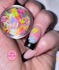 neon Chanel glitter shapes 
